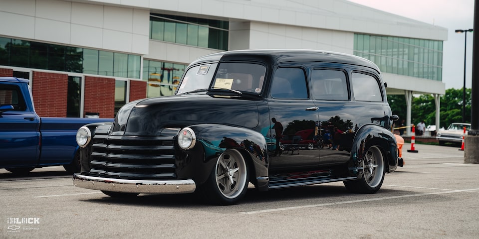 Front Three-Quarters View of David Pilgrim's 1952 Chevrolet Suburban in a Parking Lot