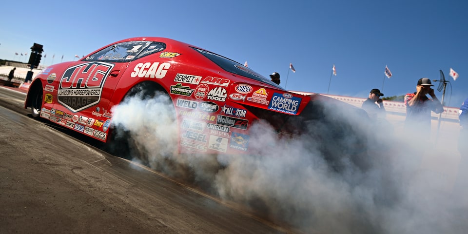 Rear Three-Quarters View of Erica Enders on the Track in Her Elite Motorsports Camaro SS