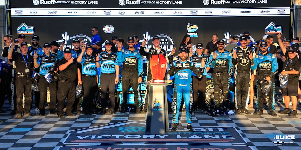 Chastain celebrates with his Trackhouse Racing team in Phoenix Victory Lane.