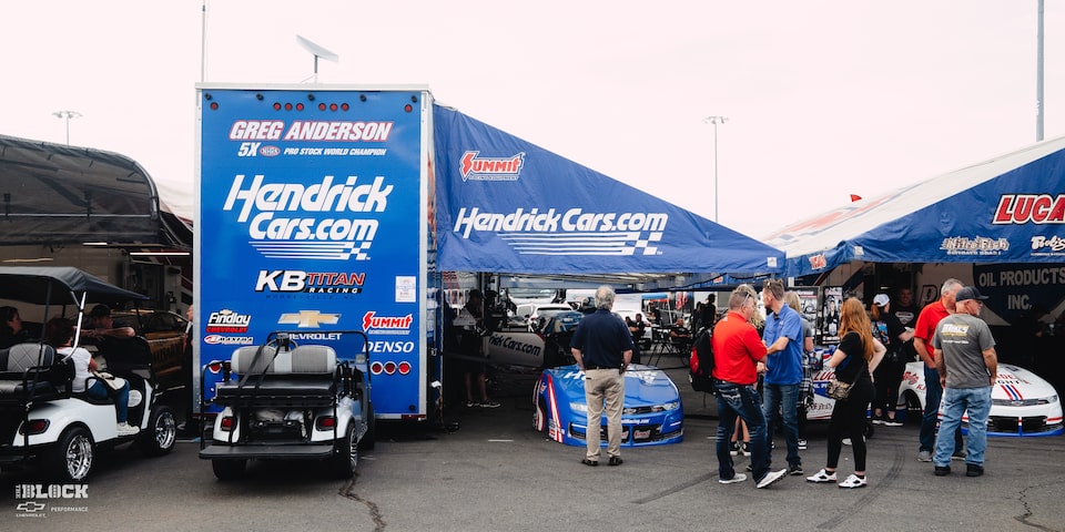 Team Chevy Driver Greg Anderson's Trailer and Race Car Surrounded by Onlookers