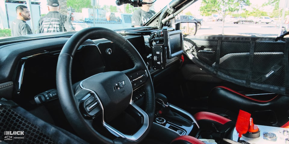 Interior View of Dashboard and Steering Wheel in a Modified Off-Roading Chevrolet Silverado Truck
