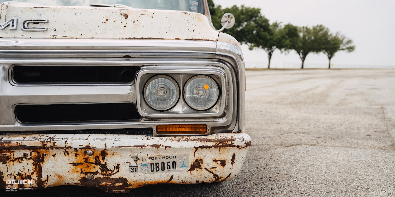 Close-Up of Headlight on Dwight Ward’s 1971 GMC C15 Truck