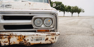 Close-Up of Headlight on Dwight Ward’s 1971 GMC C15 Truck