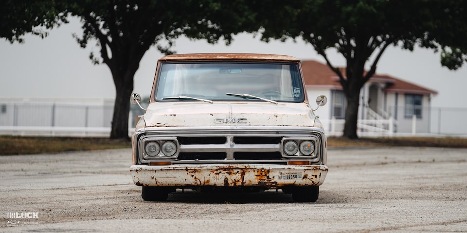 Front View of Dwight Ward’s 1971 GMC C15 Truck Parked In An Empty Lot