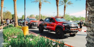 Off-Roading Chevy Trucks Parked Next to a Curb
