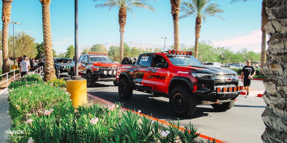 Off-Roading Chevy Trucks Parked Next to a Curb