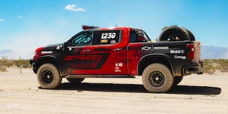  Rear Side View of a Off-Roading Chevy ZR2 Truck in the Desert