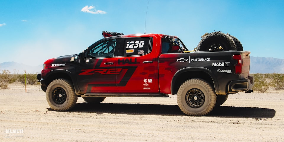  Rear Side View of a Off-Roading Chevy ZR2 Truck in the Desert