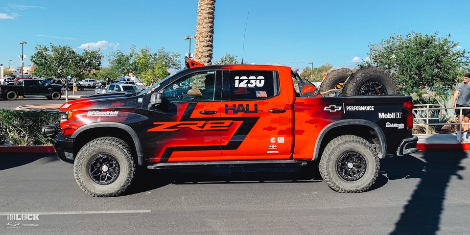 Side View of a Off-Roading Chevy ZR2 Truck With Driver Sitting Inside