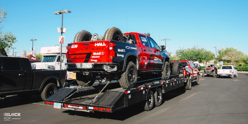 Front Side View of a Off-Roading Chevy ZR2 Truck Loaded on a Trailer