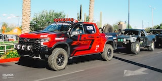 Front Side View of a Off-Roading Chevy ZR2 Truck With the Driver Inside