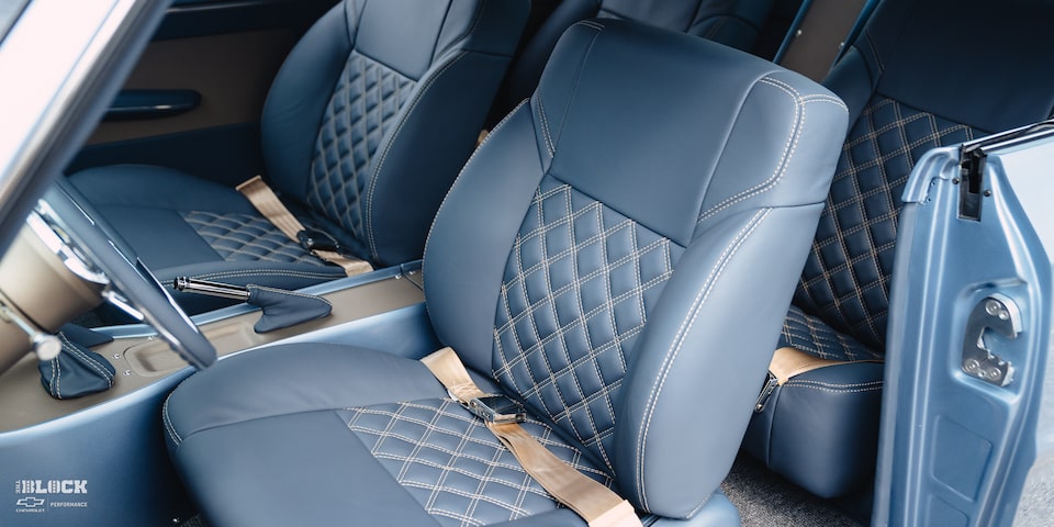 The interior maintains the checker pattern found throughout the car.