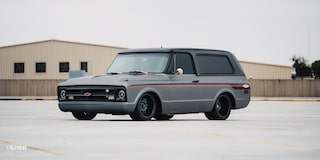 Front Three-Quarters View of 1970 Chevy K5 Blazer in a Parking Lot