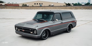 Close-up of Front Three-Quarters View of 1970 Chevy K5 Blazer in a Parking Lot