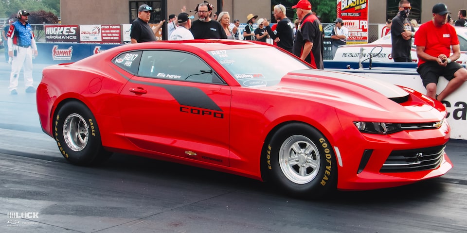 Richard Ingram's Red Copo Camaro on the Track