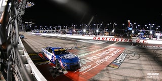 Team Chevy Driver Kyle Larson Crossing the Finish Line on a Race Track