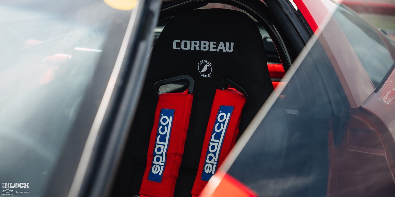 The Driver's Seat of Mitch Dixon's 1996 Greenwood Corvette With "CORBEAU" Written on the Upholstery