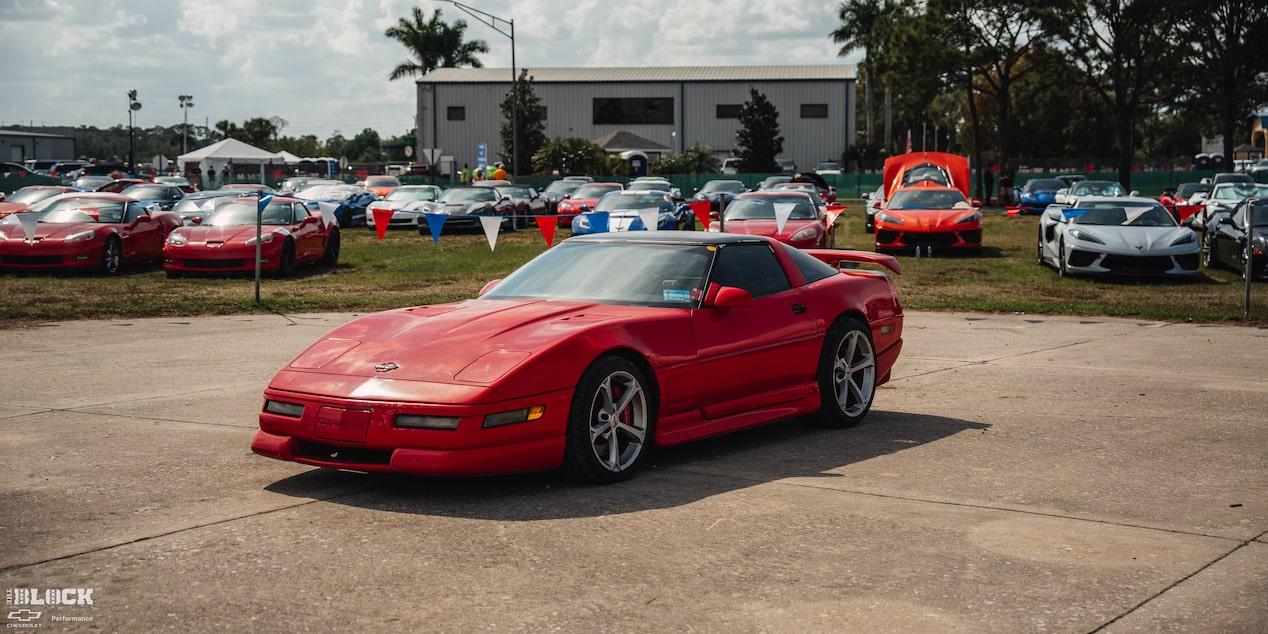Front Three Quarters View of Mitch Dixon's Greenwood Corvette Parked in Front of Dozens of Sports Cars