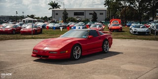 Front Three Quarters View of Mitch Dixon's Greenwood Corvette Parked in Front of Dozens of Sports Cars