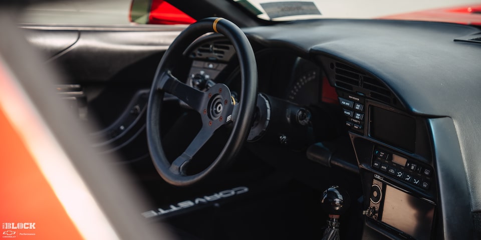 The interior is designed like a race car cockpit and includes six-way-adjustable seats.