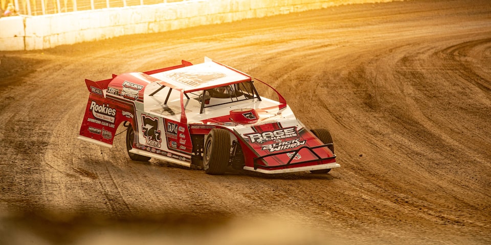 Al Hejna's Race Car Dramatically Rounds the Bend at Mason City Motor Speedway in Iowa.
