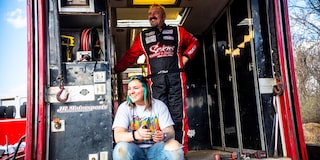 Racer Al Hejna Stands Behind His Daughter and Crew Chief, Madee Hejna, with Both Smiling Widely.