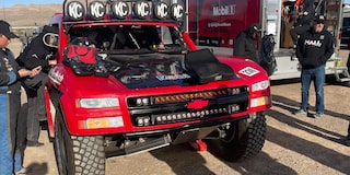 Front View of Hall Racing’s Unlimited Truck with Crew Standing Nearby