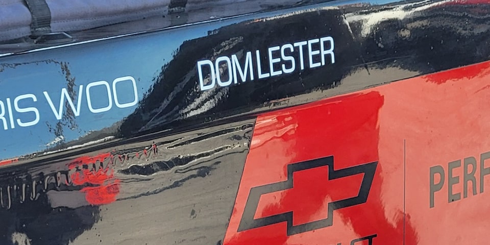 Close-up View of Hall Racing's Unlimted Truck Decal Reading "Dom Lester"