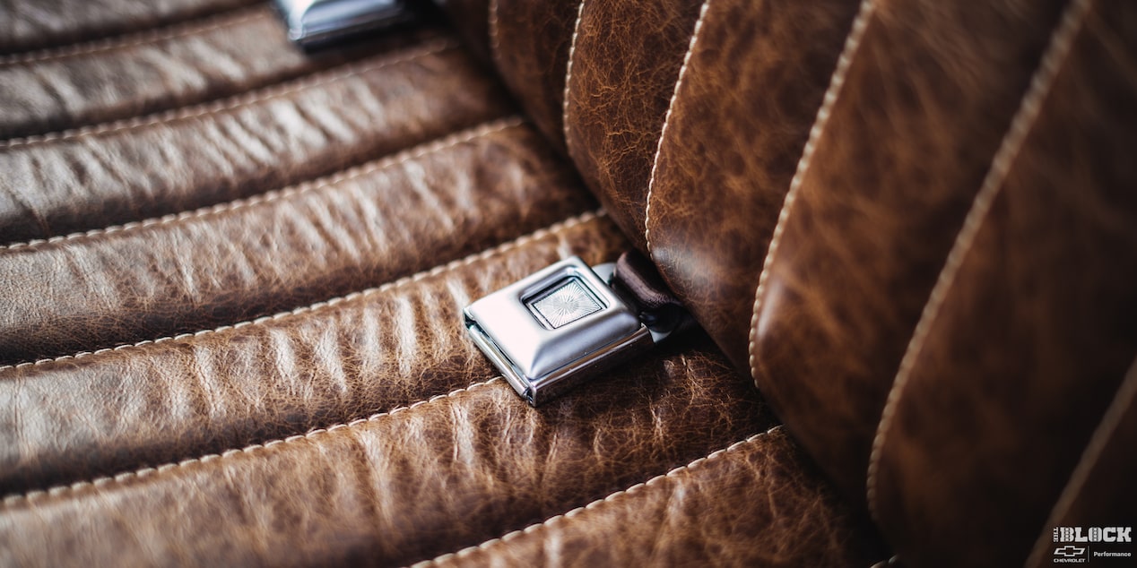 A Close-up of the Seatbelt on a Leather Seat of a 1958 Chevy Apache Pickup Truck