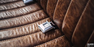 A Close-up of the Seatbelt on a Leather Seat of a 1958 Chevy Apache Pickup Truck