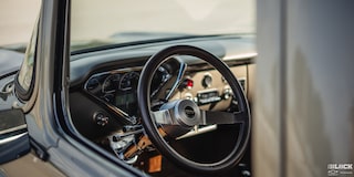 A View of the Steering Wheel from Outside the Window of a 1958 Chevy Apache Pickup Truck