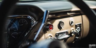 Close-up of the Dashboard and Other Functions Viewed through the Steering Wheel of a 1958 Chevy Apache Pickup Truck