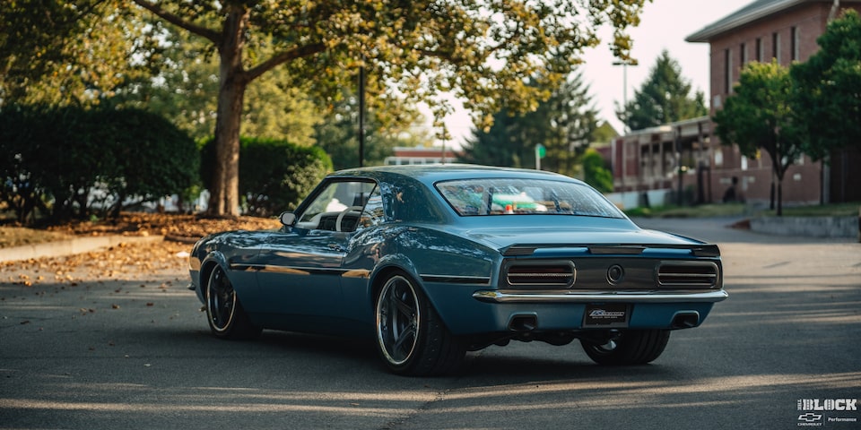 Rear View of a 1968 Chevy Camaro Parked Before a Tree