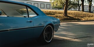 Driver's Side View of the Back Half of a Blue 1968 Chevy Camaro