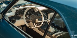 Overhead View of the Steering Wheel and Dashboard of a 1968 Camaro Seen Through the Driver's Side Window