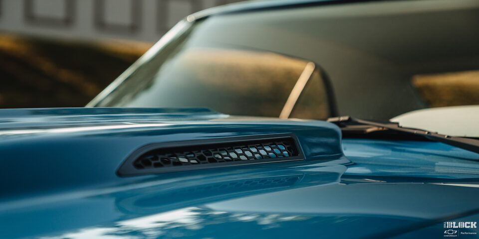Close-up of the Hood of a Blue 1968 Chevy Camaro