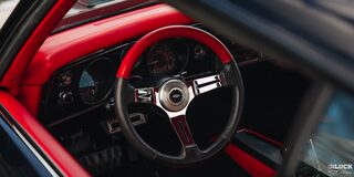Viewing the Steering Wheel of a 1969 Chevy Chevelle through the Right Window