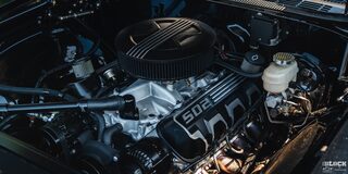 Fully Exposed Engine of a 1969 Chevy Chevelle with Its Hood Open