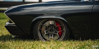 Side Low View of the Front Left Tire of a 1969 Black Chevy Chevelle
