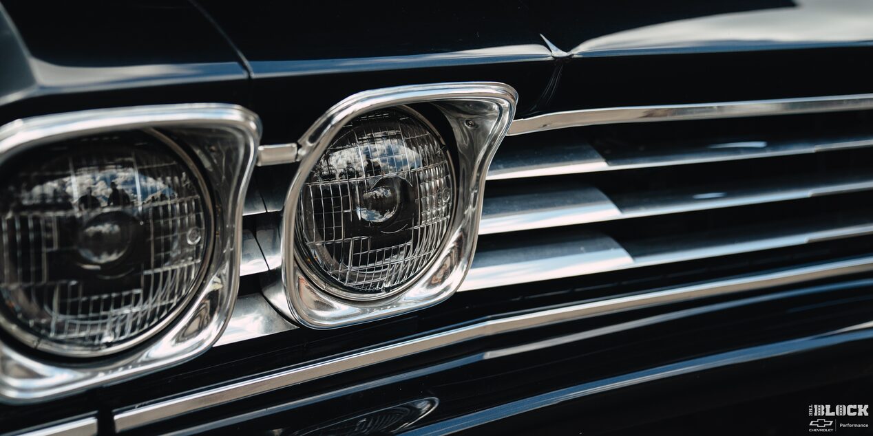 Close-up of the Headlight and Grille of A Black 1969 Chevy Chevelle