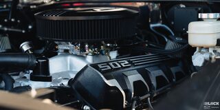 Close-up of the Engine of a 1969 Black Chevy Chevelle with ‘502’ Written on It