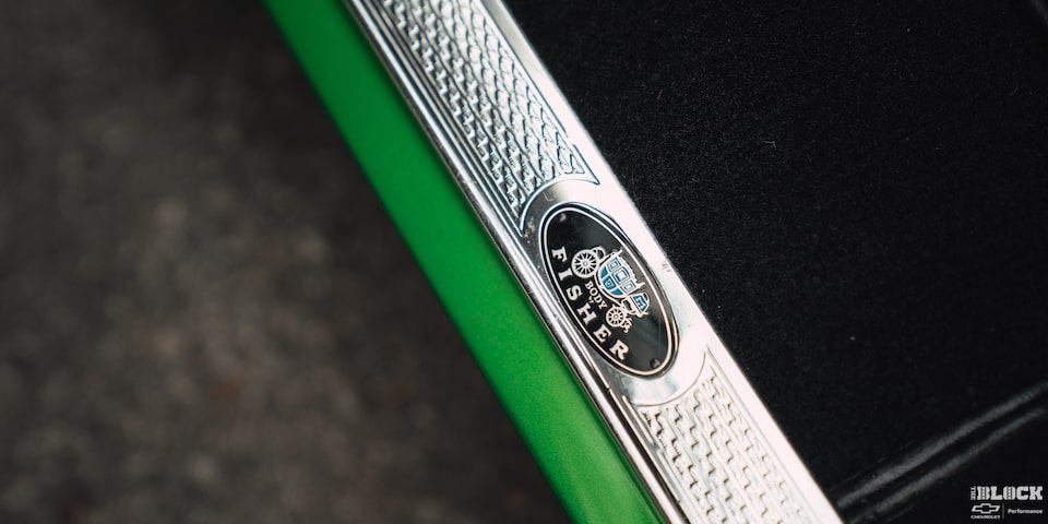 Close-up of a "Body by Fisher" Ornament on a Synergy Green 1957 Chevrolet Sedan Delivery