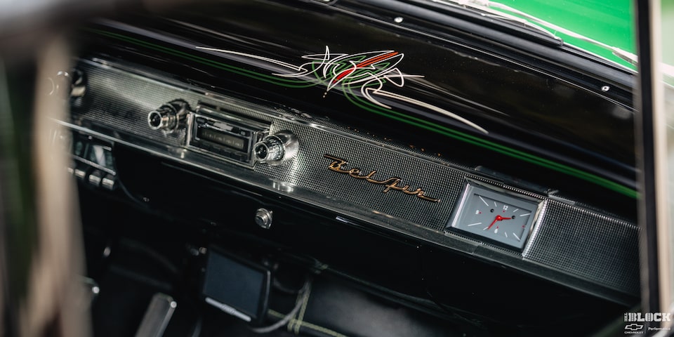 View of the Dashboard of a Synergy Green 1957 Chevrolet Sedan Delivery Through the Open Passenger Side Window