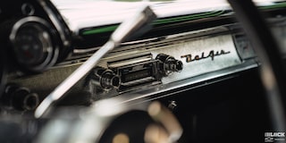 View of the Dashboard Radio Through the Steering Wheel in a 1957 Chevrolet Sedan Delivery