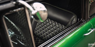 Interior View of the Black Front Seats in a 1957 Chevrolet Sedan Delivery