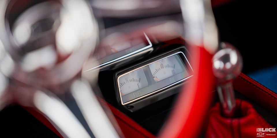 Close-up of the Fuel and Oil Gauges Seen through the Steering Wheel of a 1968 Chevy Camaro