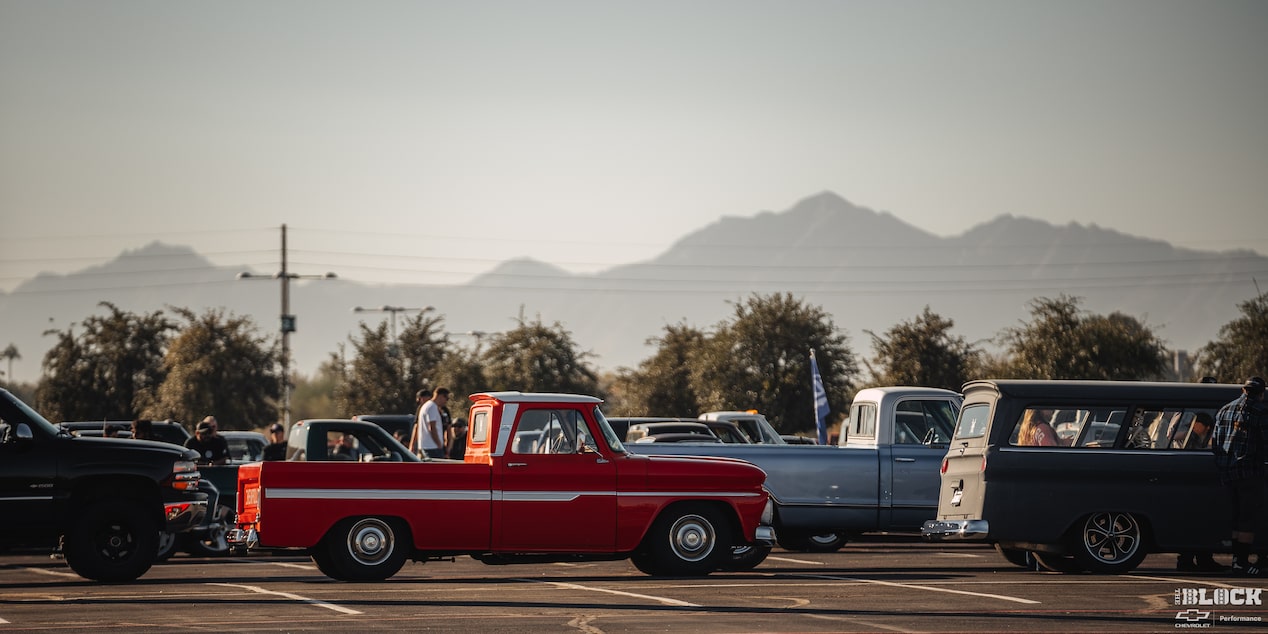 A Far Away View of a Line of Pickup Trucks and Vans at Dino’s Git Down Event