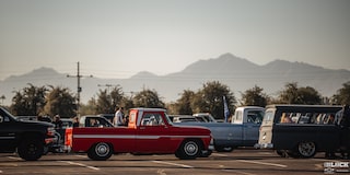 A Far Away View of a Line of Pickup Trucks and Vans at Dino’s Git Down Event