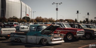 Three Quarters View of a Parking Lot Filled with Pickup Trucks and Vans for Dino’s Git Down Event