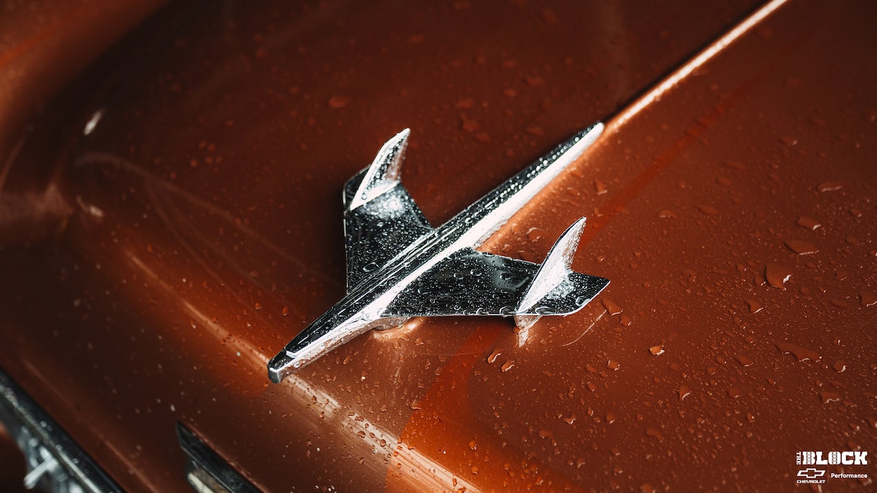 Close-up of a Chrome Hood Bird on a 1955 Chevy 210 Handyman with Rain Drops on it.